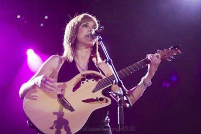 Melanie Lowe performing at a South African music venue