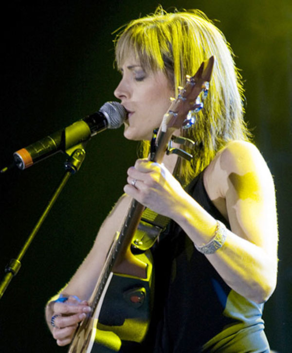 Melanie Lowe performing at a South African music venue